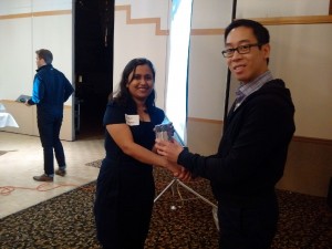 Vaishali accepting her gift from Carl