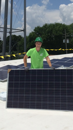 Joshua Jacobsen from the University of Missouri – Columbia as he installs a solar panel during this summer internship with EnergyLink.