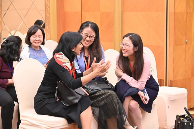 Fig. 6 Networking and discussion among attendees (Lei Han, seated in the middle, is the director of editorial office of CSEE JPES)