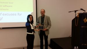 Prof. Cecilia Wang, Sarnoff Chair, presenting plaque to Prof. Edward Lee