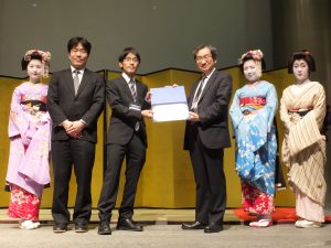 The IEEE CEDA AJJC SASIMI 2016 Young Researcher Award has gone to Shu Hokimoto (Kyoto Univ., Japan). (2nd From the left) Dr. Chikaaki Kodama (Secretary of CEDA AJJC), Shu Hokimoto (Winner of SASIMI Young Researcher Award 2016) and Prof. Mineo Kaneko (TPC Chair of SASIMI 2016)
