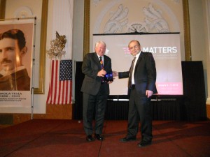 Al Rotz receiving Tesla Spirit Legacy Guardian Award from Nikola Lonchar, President of the Tesla Science Foundation
