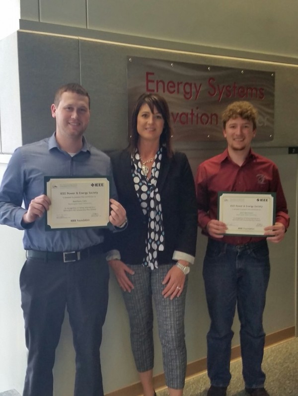 Matt Cato (Left) and John Martinsen (Right) from Washington State University with Jackie Peer, Director of SEL University from Schweitzer Engineering Labs, Inc. 